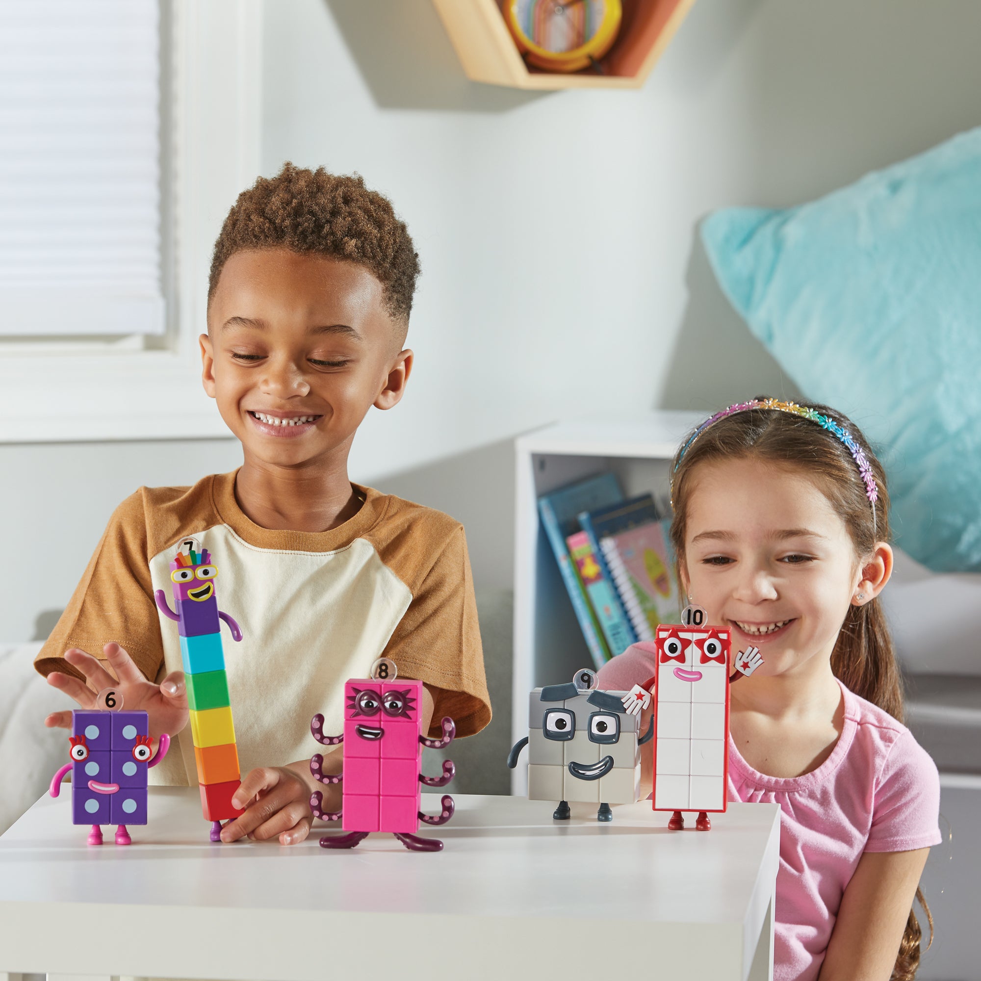 2 children playing with the Numberblocks Friends Six to Ten  pretend play toys